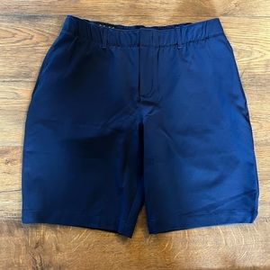 Under Armour navy blue shorts. Size 8. 9” in length.
